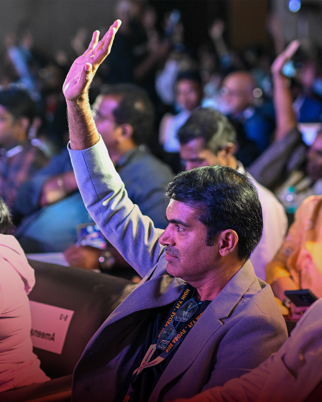 A Social Eagle community member raising their hand to answer at a live event.